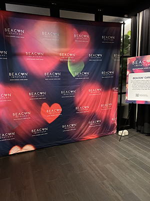 A backdrop with hearts and flowers for a photo op