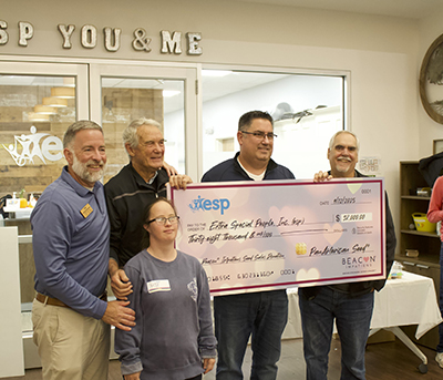 Giant check being presented to esp organization